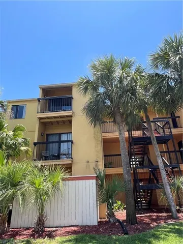 View of property with stairs