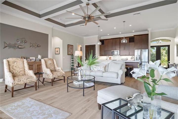 View looking out towards the kitchen and entryway - this home is flooded with natural light in every room with easy access to all living areas, both inside and out.