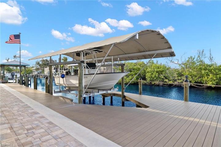 The boatlift and boat is canopied and provides shade for your boat.  This should easily accomodate most 23 foot boats and is 7000 pounds.  Deep water and should accomodate deeper draft needs for boating.  Electric to the dock and outdoor lighting is built in.