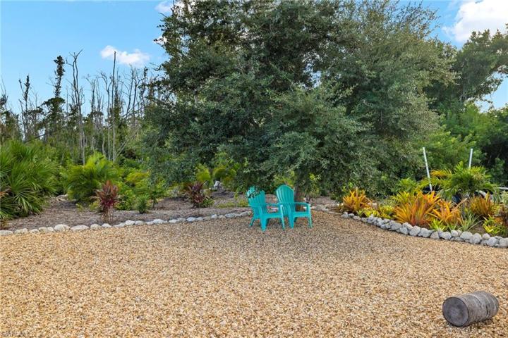 Across from this home is an incredible oasis/retreat where you can park your boat, boat trailer etc.  It is deeded to the property and ownres have turrned into a beautiful garden with shade tree - a zen oasis.