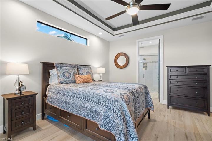 Master bedroom is a true retreat!  Tray ceiliing with back lighting, sliders to the outside and beautiful plantation shutters!  Large walk in closet was designed to maximize storage and is all wood shelving.