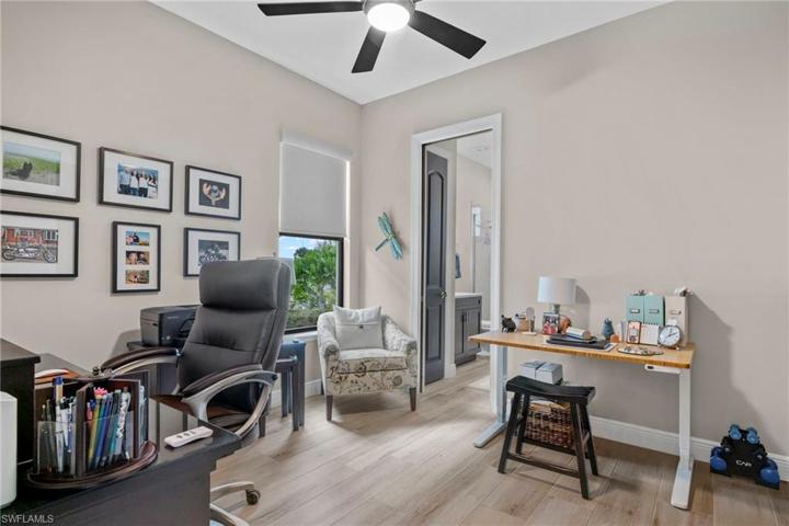 Junior master suite currently used as an office.  Attached bathroom and exit outside to the pool area!
