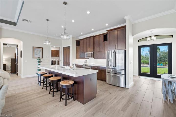 Photos do not do this beautiful kitchen justice!  2.5 inch Brittania Cambria Quartz - 42 inch cabinets with crown molding, GE Cafe appliances including invection oven - this kitchen is perfect for gourmet chefs - tons of cabinet storage space, beautiful design and lots of counter space for entertaining.