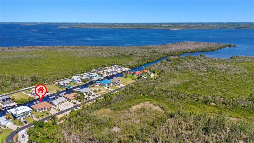 Beautiful aerial view showing proximity of the home to Manatee Bay and the open waters.  Heaven on earth!
