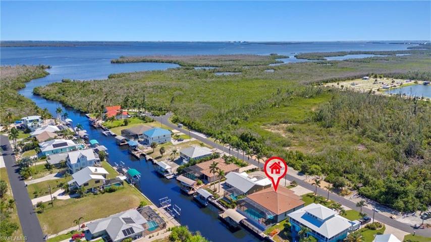 This home is located on a dead end street with a beautiful garden and boat parking directly across from the home.  An abundance of nature, birds and tons of dolphins and manatees - come live where the dolphins play!