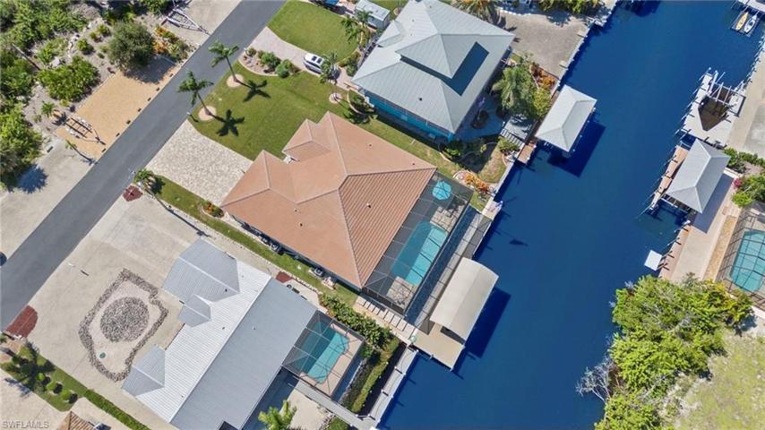 Birds eye view of this beautiful home and outdoor dock and back yard!