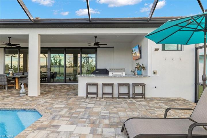 View towards the home of the outdoor kitchen, outdoor shower and the covered patio - there are no small spaces here!