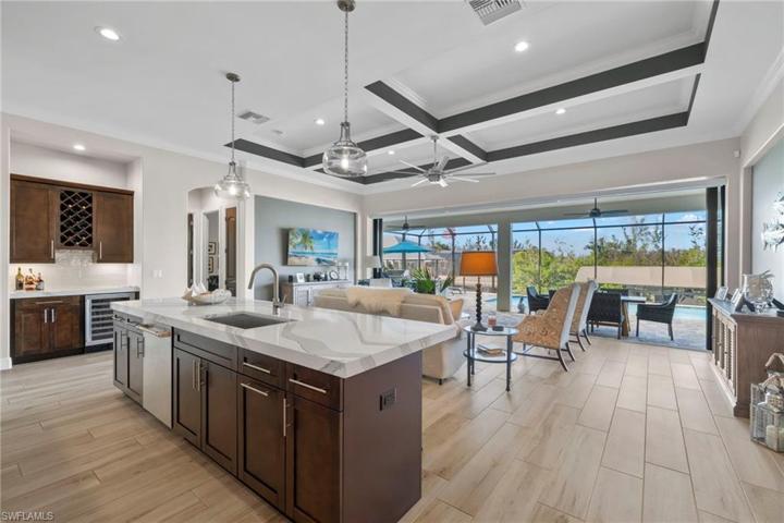 The kitchen is the heart of the home!  Open concept with great room and extended outdoor living space make this a dream layout.