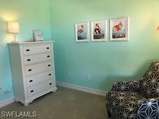 Third bedroom with a day bed, large walk-in closet and top down shades overlooking quiet community.