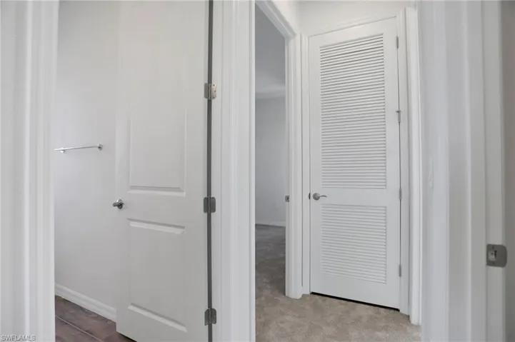 Hall featuring baseboards