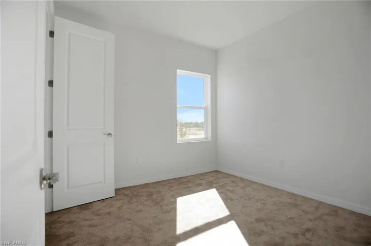 Empty room featuring carpet flooring