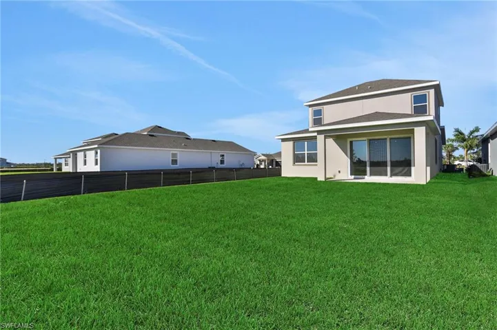 Back of house with stucco siding