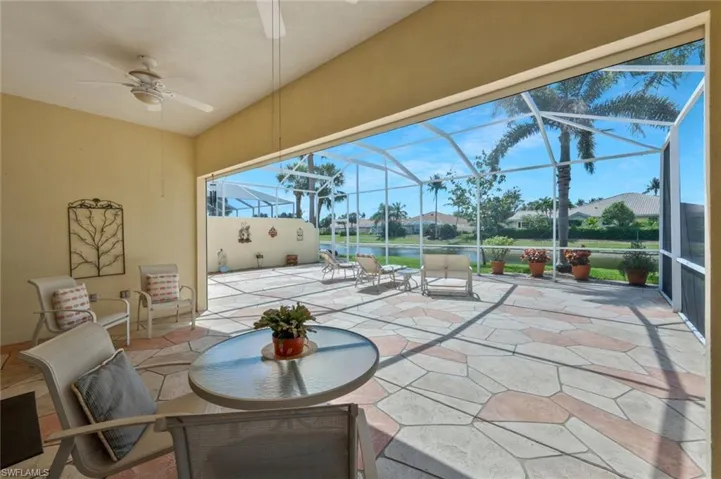 View of patio / terrace with ceiling fan and a lanai
