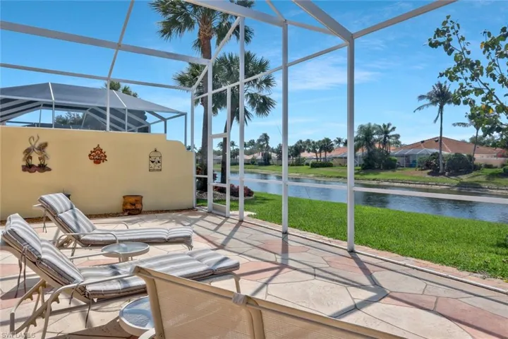 Unfurnished sunroom with a water view