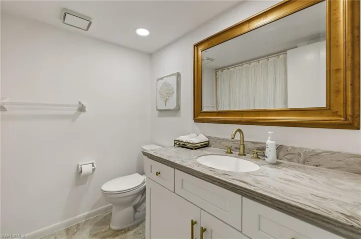 Guest bath with newer cabinet and granite
