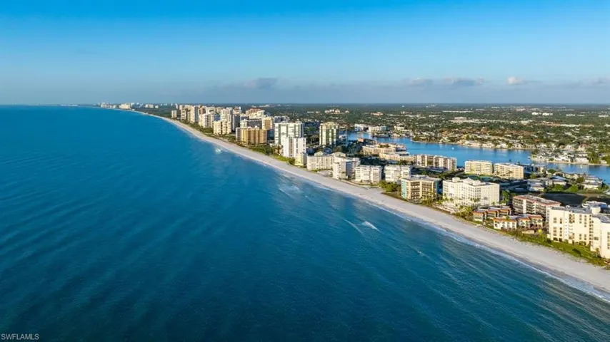 View of urban area with waterfront with a beach