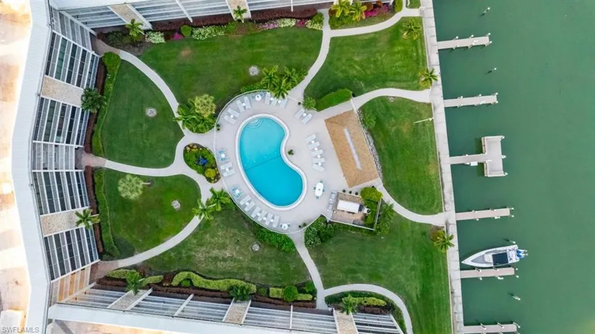 Aerial view of property's location featuring a pool area
