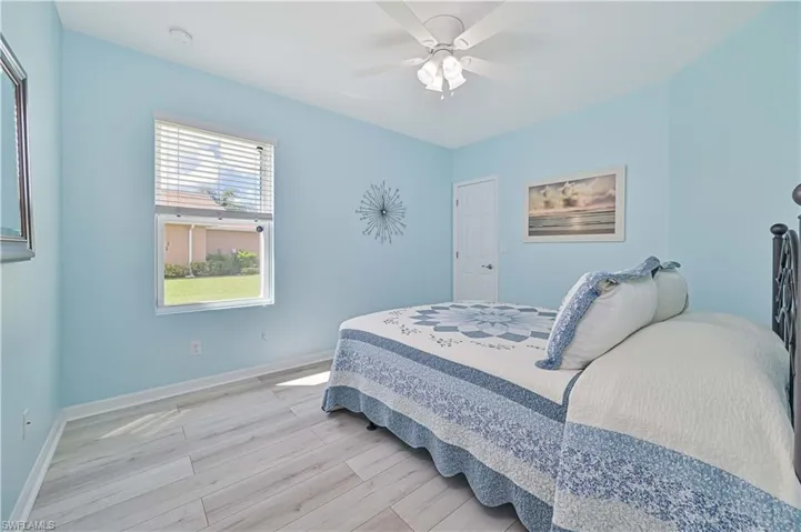 Bedroom with light wood-type flooring and ceiling fan