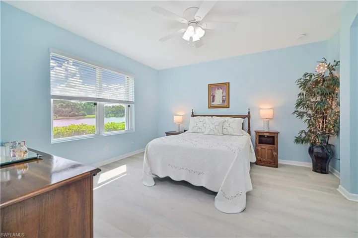 Bedroom with light hardwood / wood-style flooring and ceiling fan