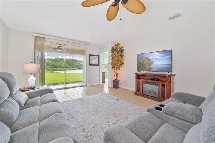 Tiled living room with ceiling fan