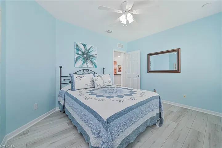 Bedroom featuring light wood-type flooring and ceiling fan