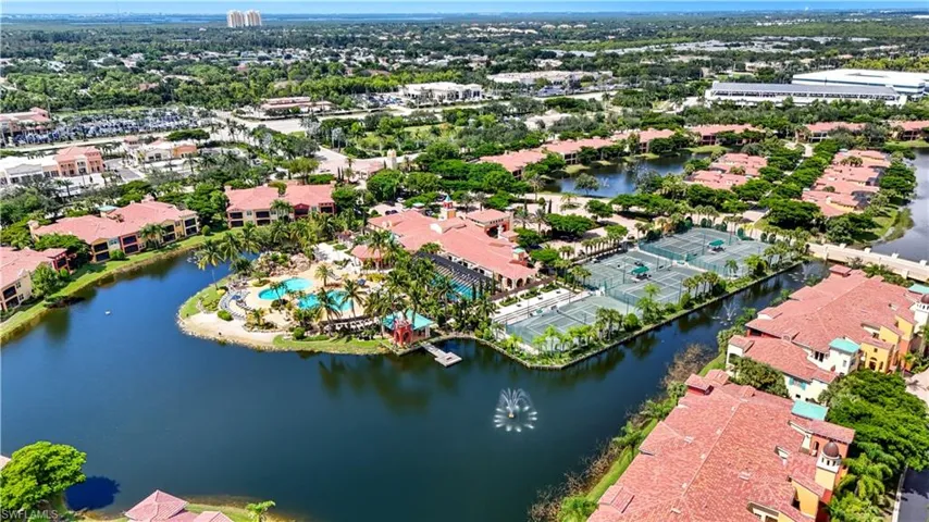 Aerial perspective of suburban area with a large body of water