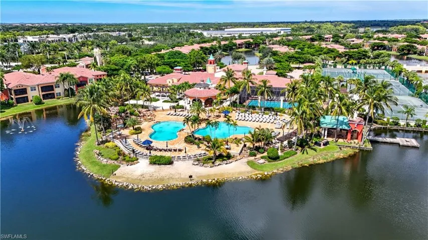 Drone / aerial view of a large body of water and a pool area