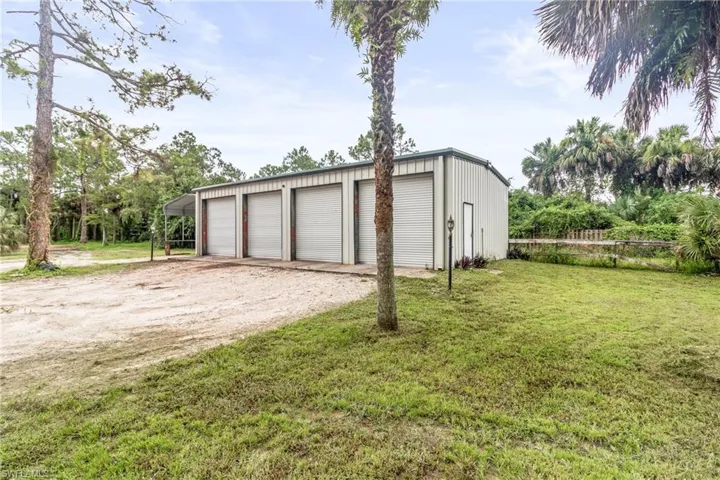 Garage featuring a yard