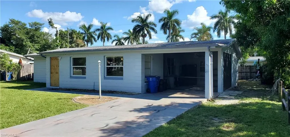 Ranch-style home with a front yard