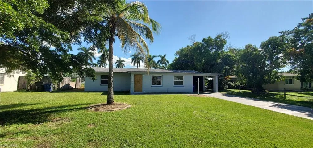 Ranch-style home with a front yard