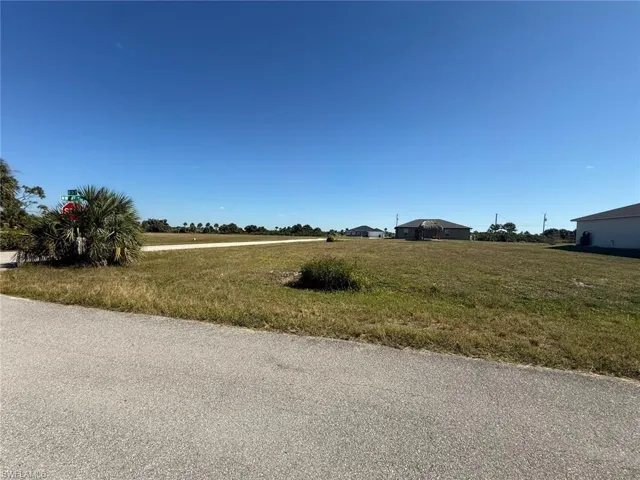 View of asphalt road with a rural view