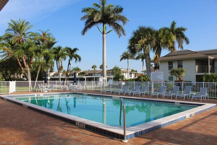 Community pool featuring a patio