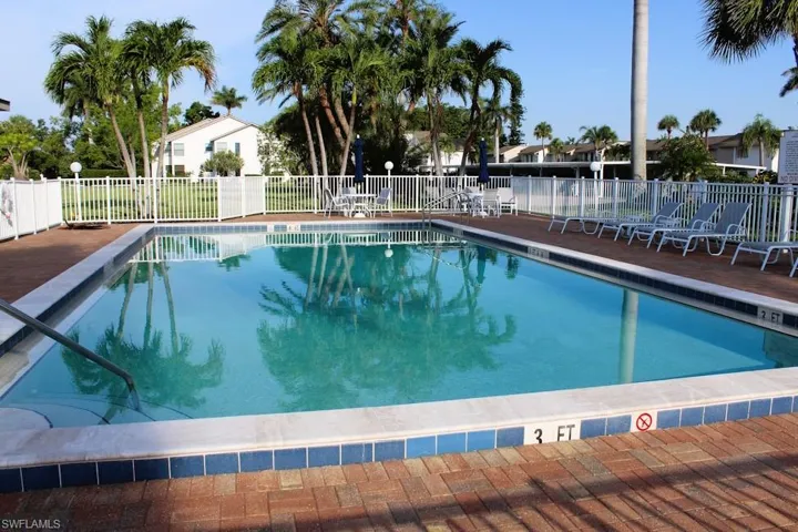 Community pool featuring a patio area
