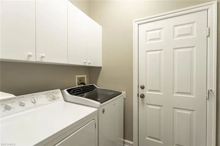 Laundry room with garage door.