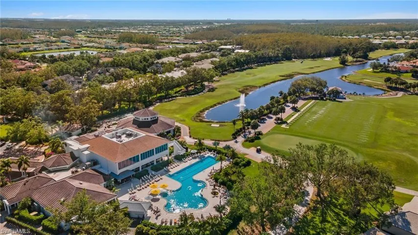 The "Clubhouse at Gateway", resort style swimming pool, fitness center on the 2nd floor, driving range, to the right & 10th hole where the water is In front of the club house in the upper center of the picture..