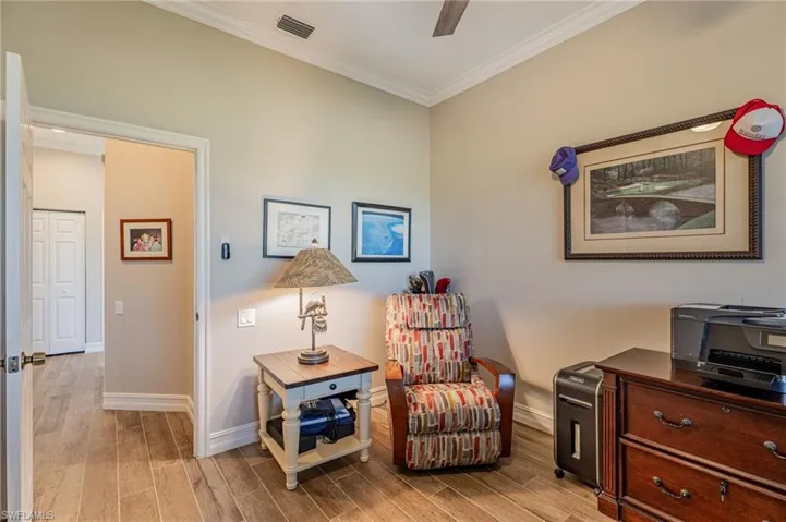 Door/hall to enter the den, adjustable recliner to relax on, & other furniture.