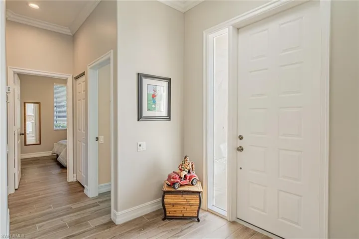 Walking past the front door on the right, you then have the door to the laundry room, garage, closet and guest bedroom.