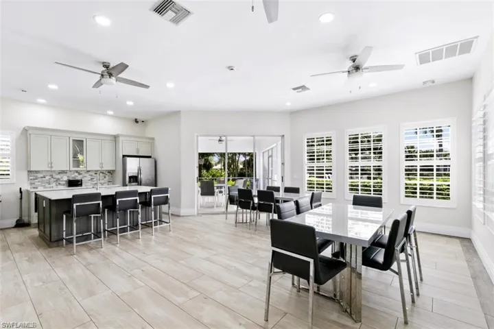 Second social room with refrigerator, oven and sink