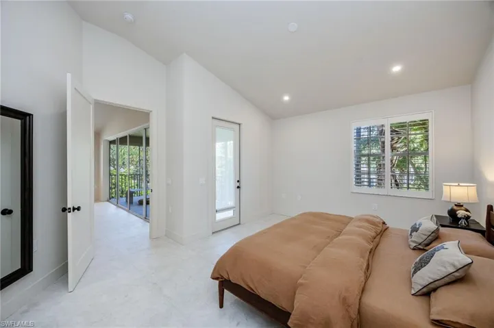 Primary bedroom with door to lanai