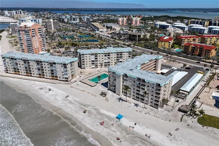 Birds eye view of property featuring a view of city and a water view
