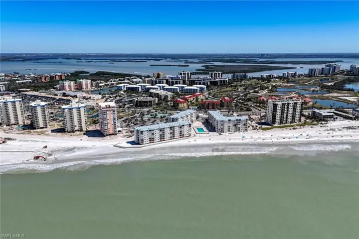 Drone / aerial view featuring a view of city, a beach view, and a water view