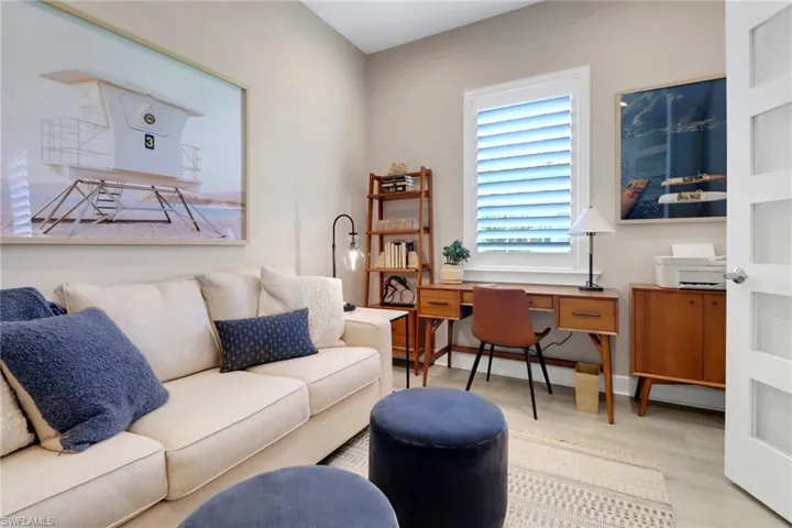 Office with wood finished floors and baseboards