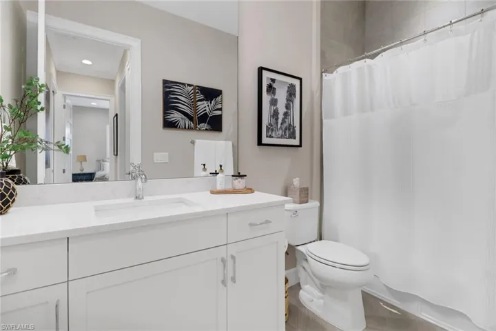 Ensuite bathroom with vanity and toilet