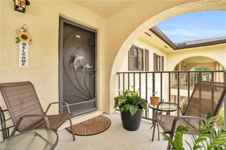 Entrance to property featuring a balcony