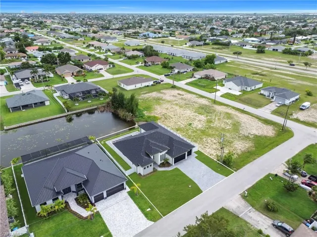 Aerial perspective of suburban area with a large body of water