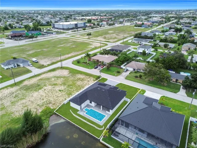 Aerial perspective of suburban area with a pool