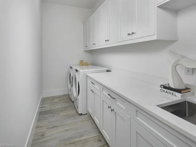 Laundry room with ample counterspace and built in cabinetry