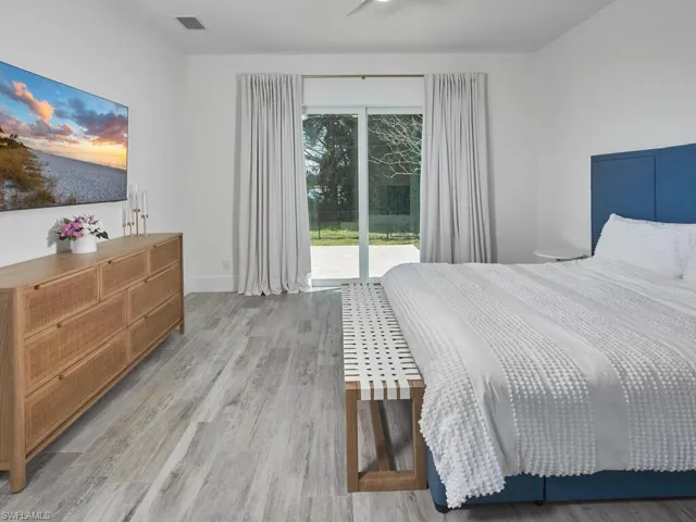 Primary Bedroom featuring sliding glass doors leading to outdoor patio