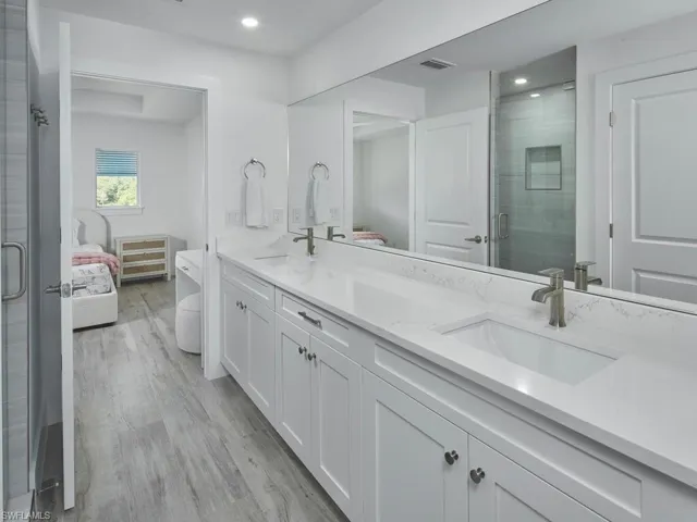 Jack & Jill bathroom with double vanity and walk-in shower