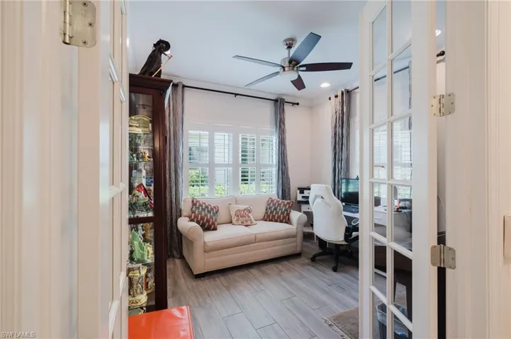 Home office with wood finished floors, a ceiling fan, french doors, crown molding, and recessed lighting